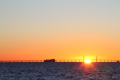 The outline of wharf at sunset
